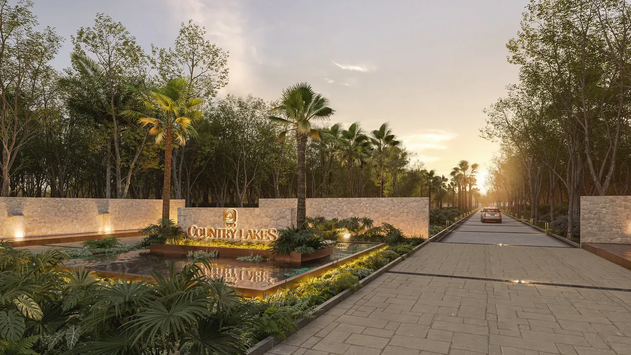 Entrance portico with the Country Lakes sign and reflecting pool at sunset